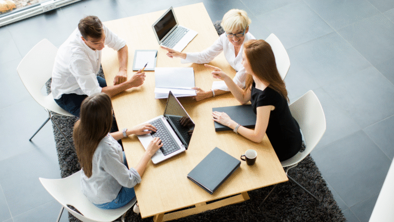 Team meeting representing The Resilience Effect’s focus on leadership behaviours that create resilience and psychological safety.